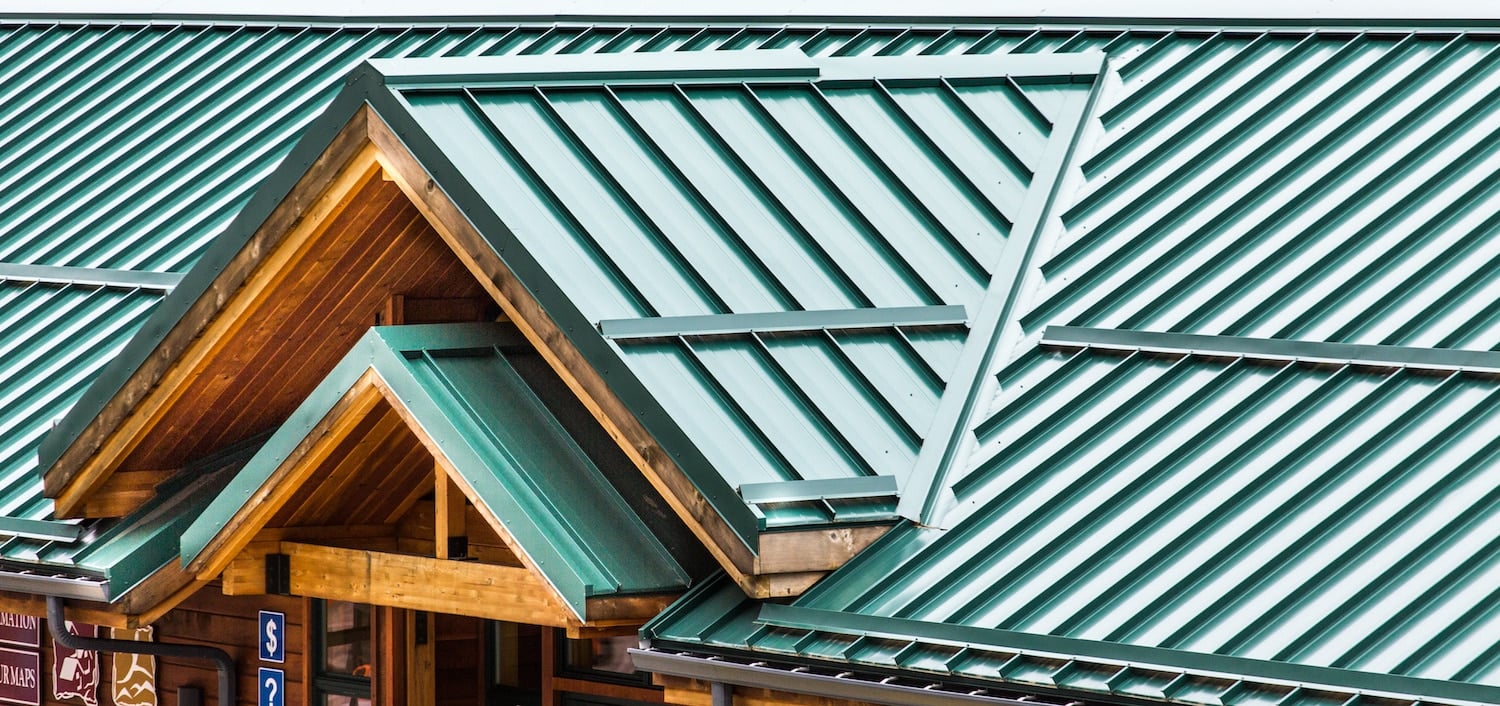 Green Metal Roof on Wood Building minimum pitch for metal roof featured