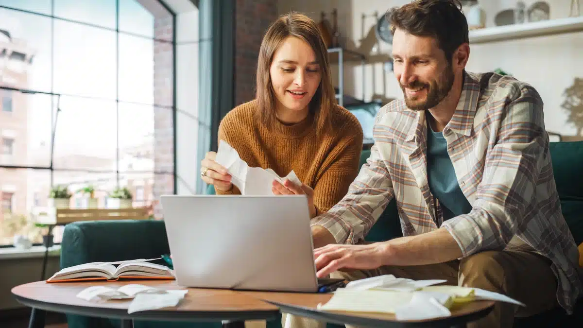 young couple finances new roof and determines replacement return on investment