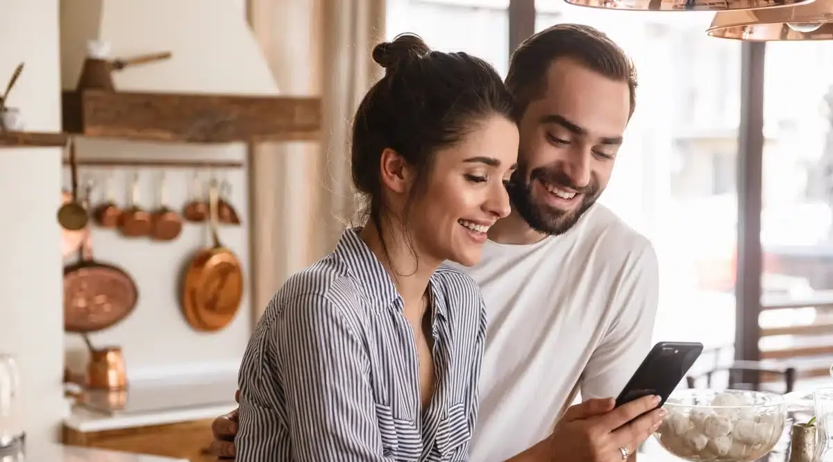couple asks contractor questions on phone couple at home calls and asks contractor roofing questions