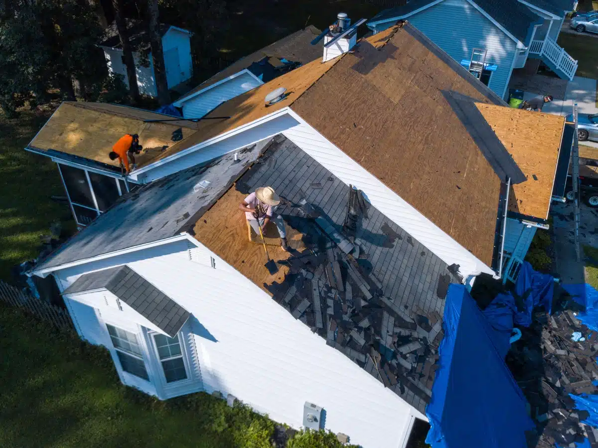 team working on a full roof replacement