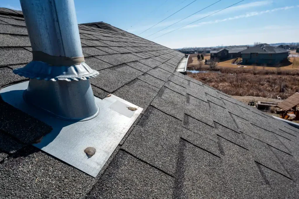 close up to roof flashing of asphalt shingle roof 