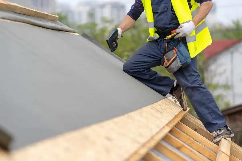 worker performing emergency roof repair