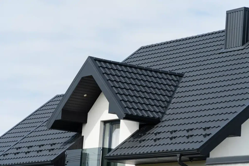 black metal roof tiles on a white home