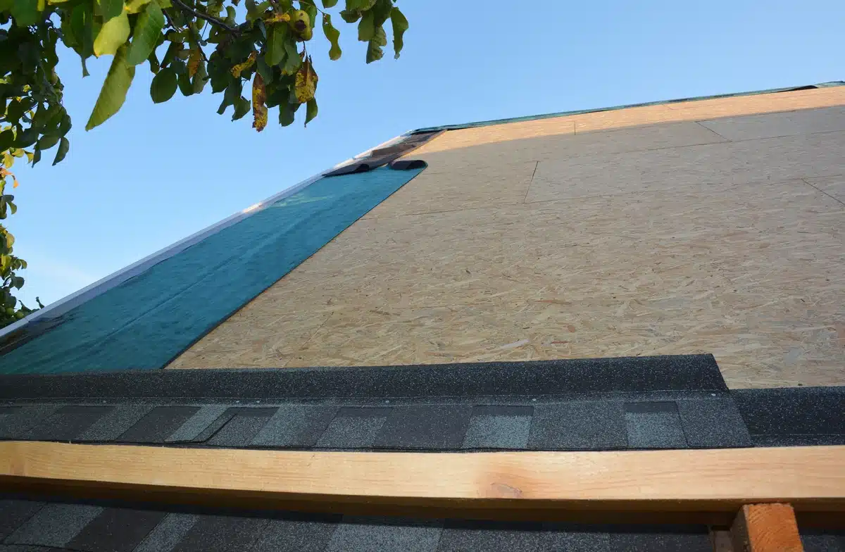 close-up-to-new-shingles-and-underlayment roof underlayment: close up to house roof shingle installation