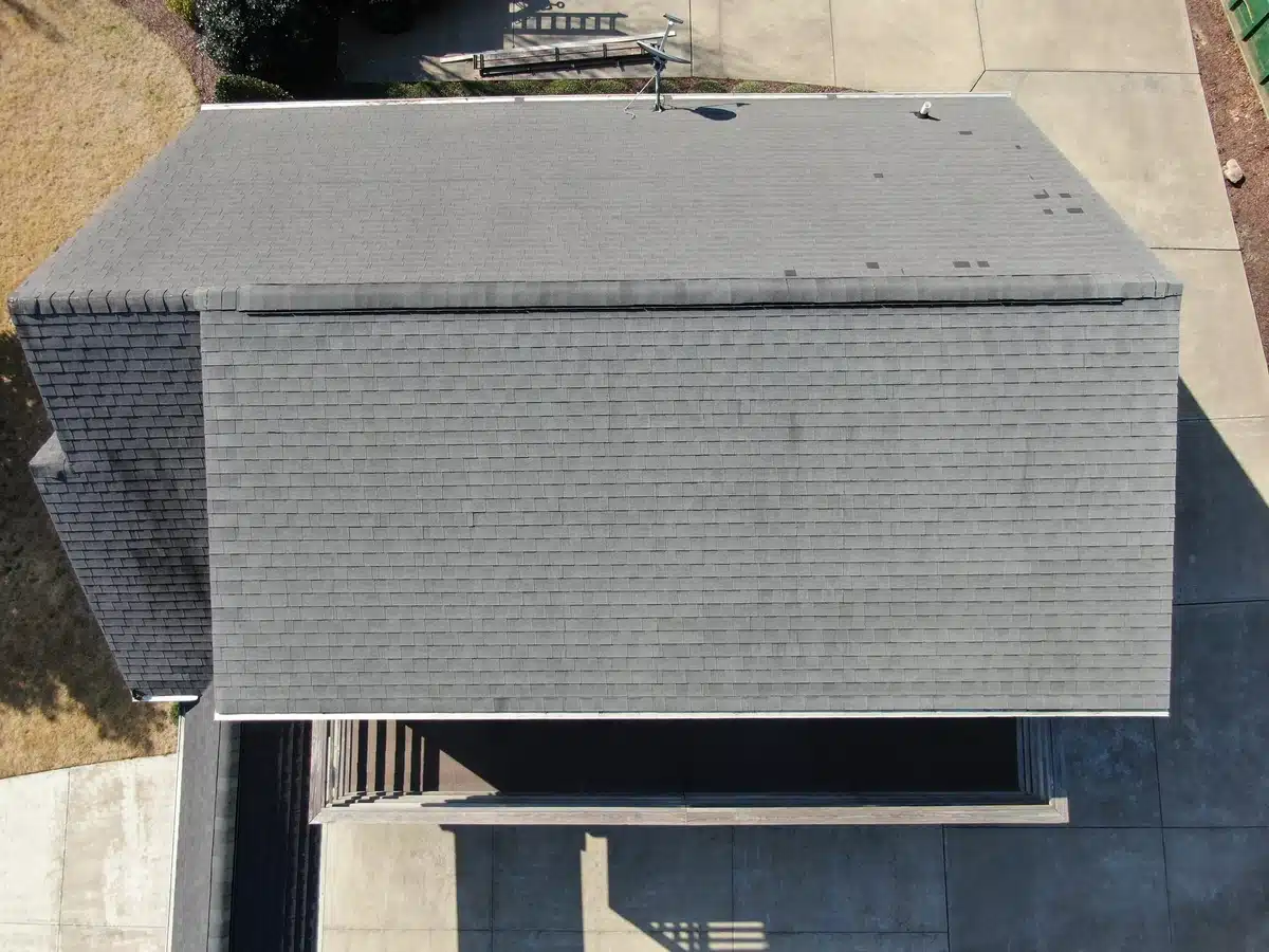roof-with-missing-shingles aerial view of house shingle roof