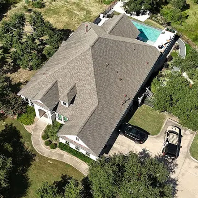 Aerial view of a home roof beside a pool
