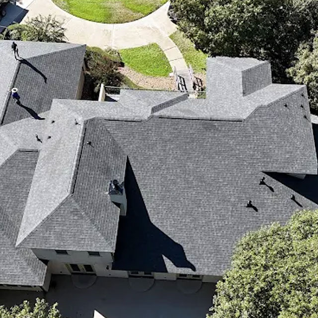 Overhead view of a large shingle roofing project