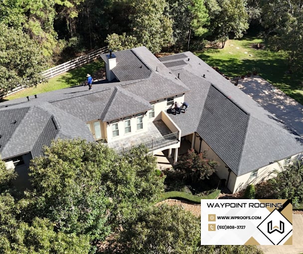 Waypoint roofing crew working on a Central Texas shingle roof