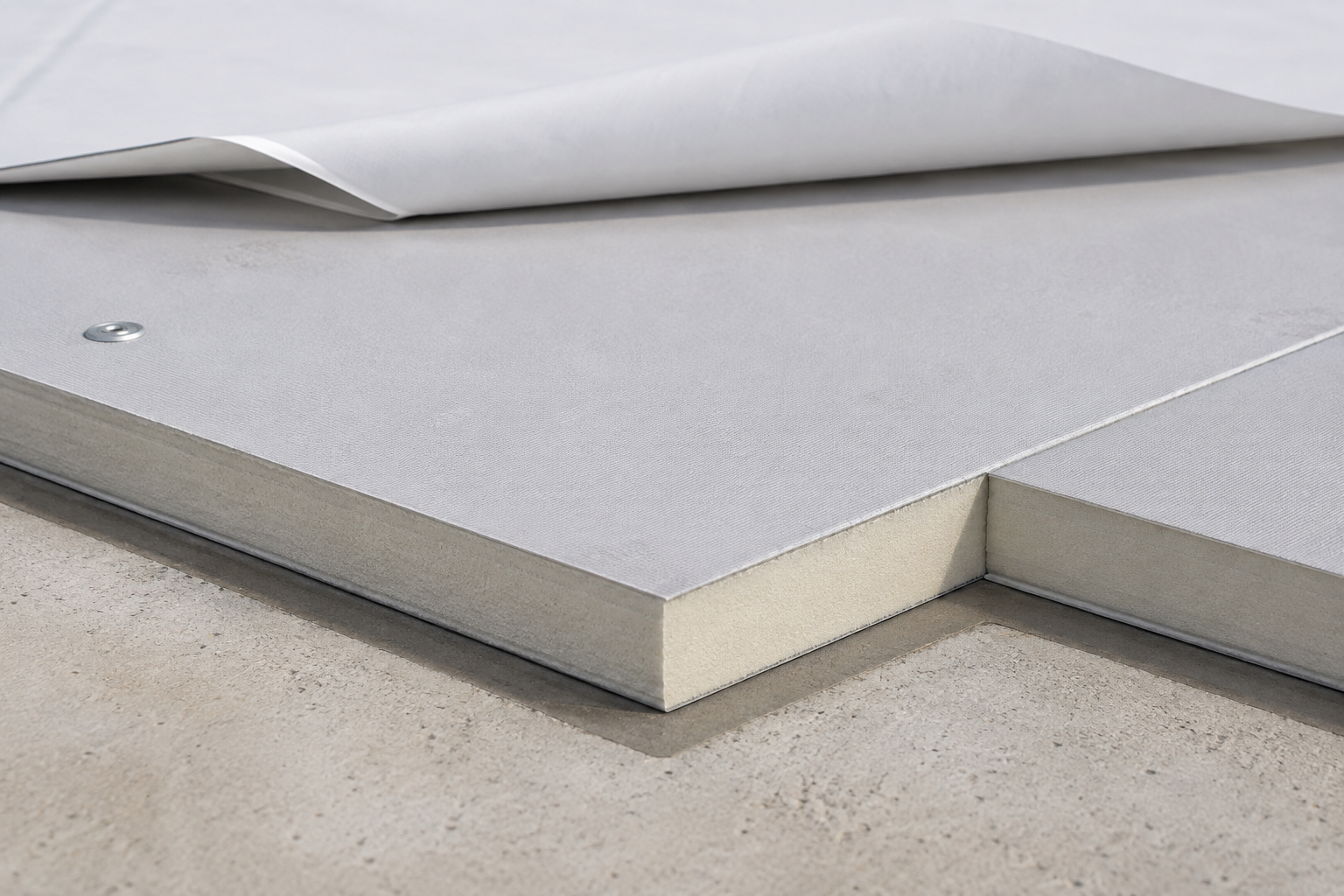 Illustration of rigid roof insulation boards beneath a white membrane