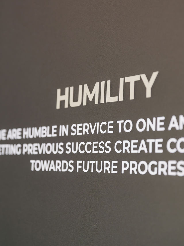 Waypoint Roofing office value wall highlighting humility